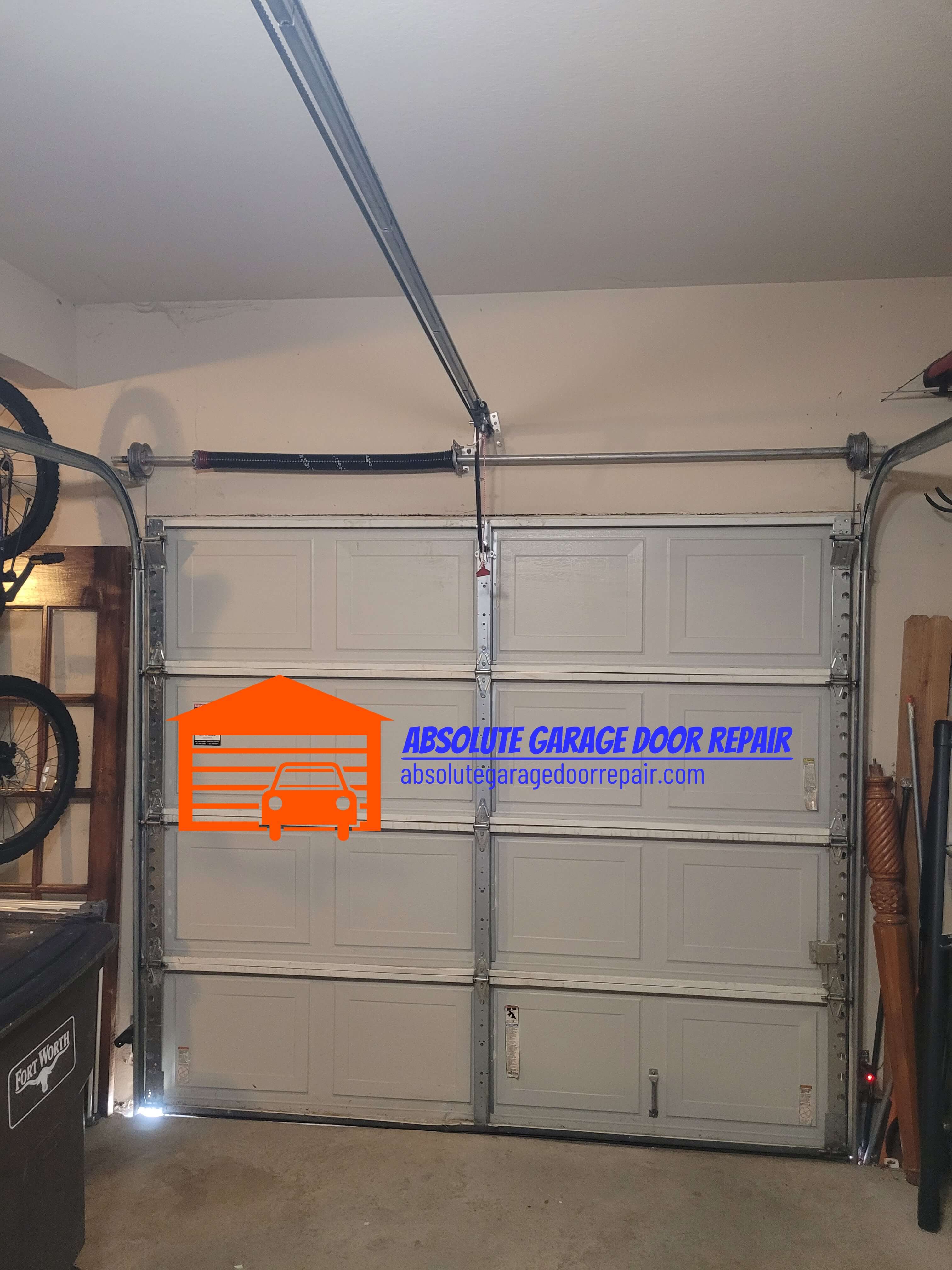 absolutegaragedoorrepair.com_garage_door_spring_replacement